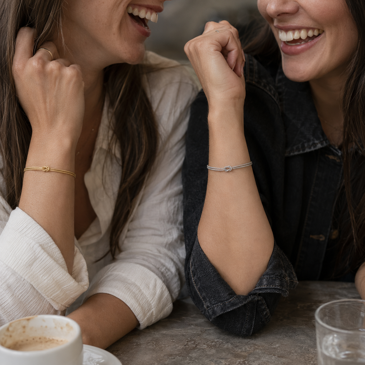 Best friends wearing faithful Gold and Silver MURREN Forever Bond bracelets