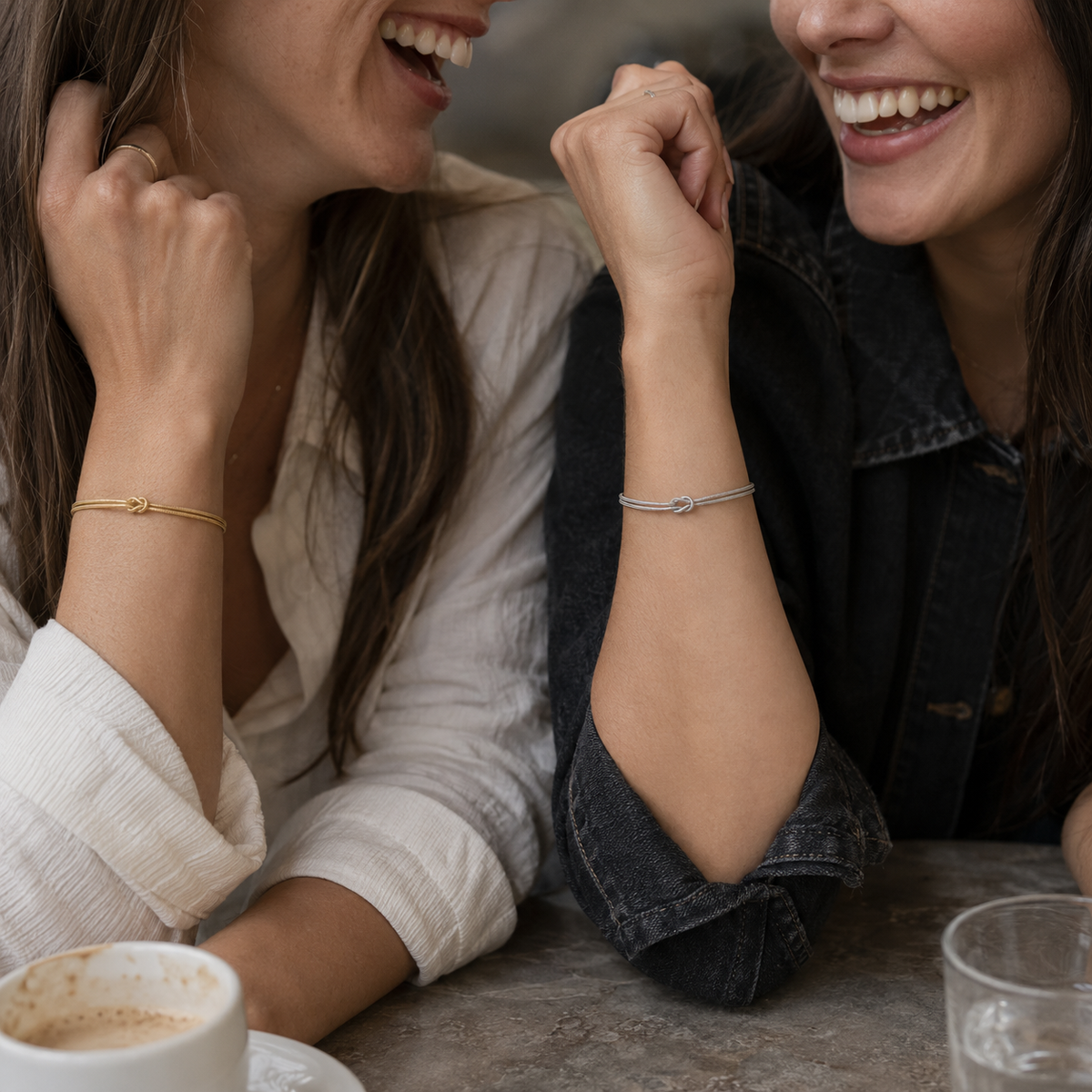 Best friends wearing faithful Gold and Silver MURREN Forever Bond bracelets