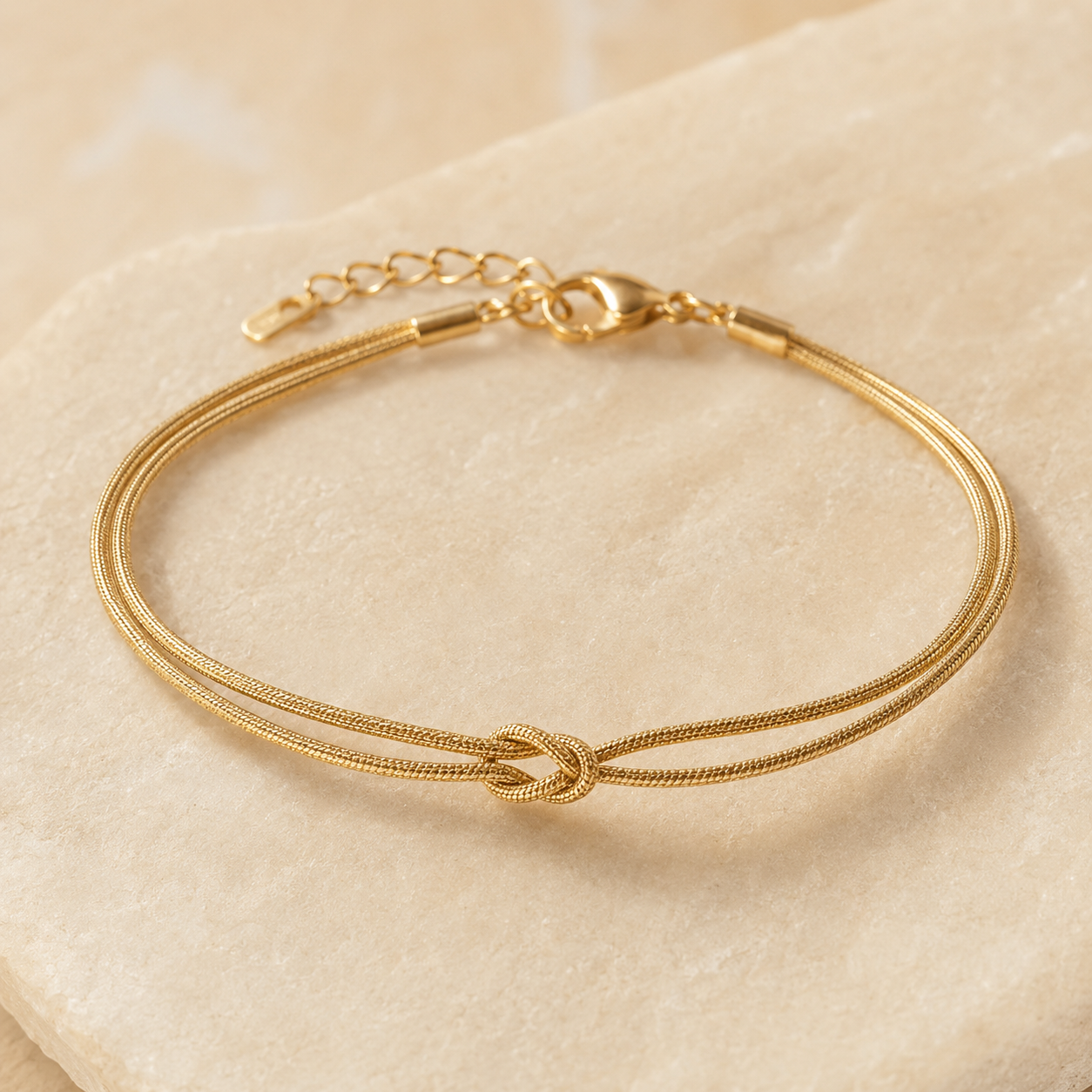 Gold MURREN Forever Bond Knot bracelet with two fully textured strands